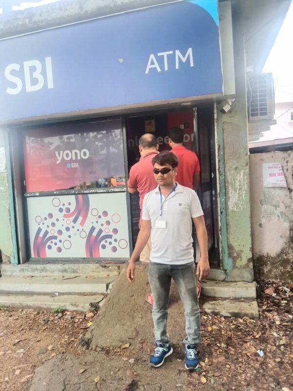 photo"BLT member in front of the ATM"